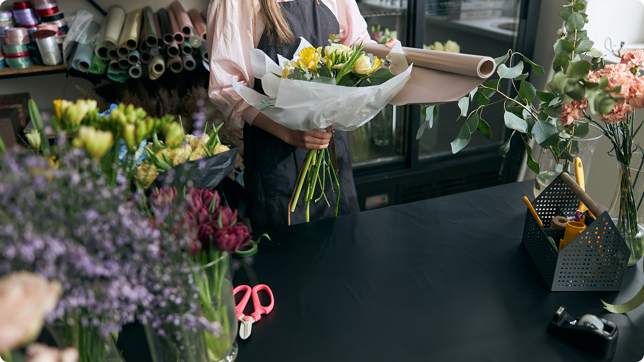 Florist holding beautiful flowers